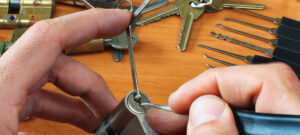 :person fixing a lock